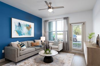 Gorgeous luxury vinyl plank flooring in living room, kitchen & bathroom
